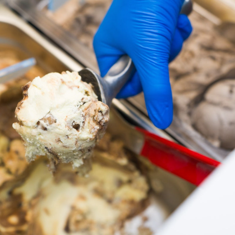 Scooping 1.5 Degree gelato at the counter